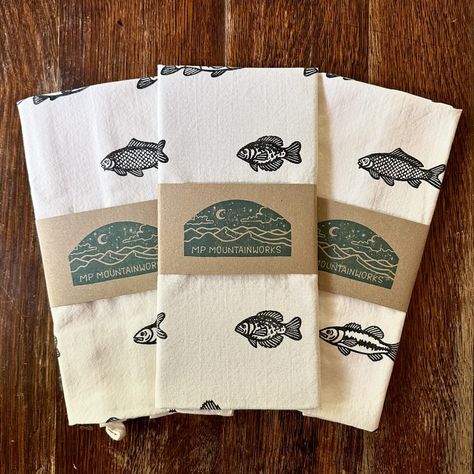 a few recent additions to the shop! Fish tea towels, fish trio block prints, & peony block prints embellished with watercolor | #blockprinting #printmaking #printmaker #handmade #natureart #fishart #ctart #ctartists #connecticutbusiness #ctsmallbusiness #makerswithmoxie Fish Decor Ideas, Fish Decor, Art Fish, Hand Carved Stamps, Printed Tea Towel, Brown Trout, Largemouth Bass, Ideas Handmade, Fishing Decor