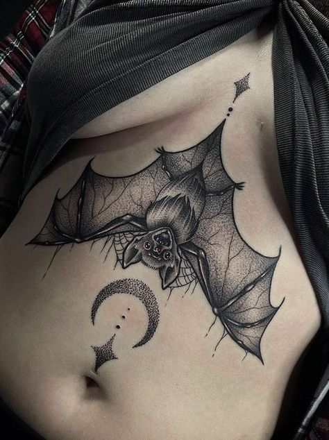 100 Sophisticated Bat Tattoos (Most Modern Ideas) - The Trend Scout Witchy Bat Tattoo Ideas, Small Feminine Bat Tattoo, Bat Tattoo On Ribs, Half Butterfly Half Bat Tattoo, Bat Lower Stomach Tattoo, Bat Tattoo Ideas Gothic, Bat Above Knee Tattoo, Bat Torso Tattoo, Detailed Bat Tattoo