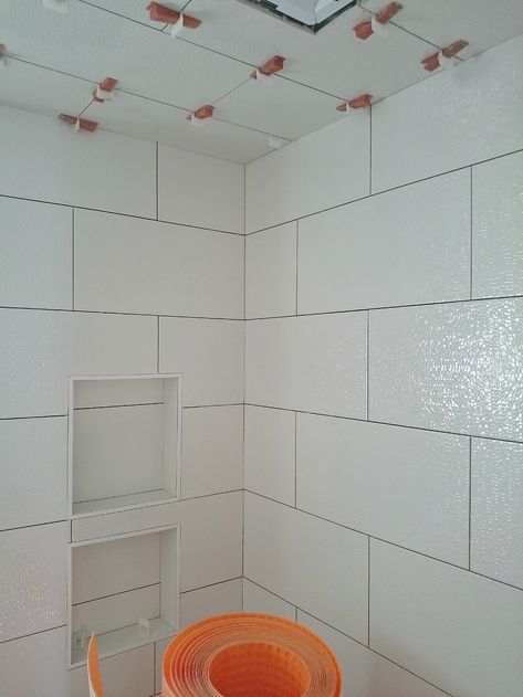 How to tile a ceiling Tiled Tub Surround, Shower Ceiling Tile, Tiling A Bathroom, Tiled Tub, Tiles In Bathroom, Ceiling Tiles Bathroom, Shower Ceiling, Tile Ceiling, Fixer Upper Bathroom