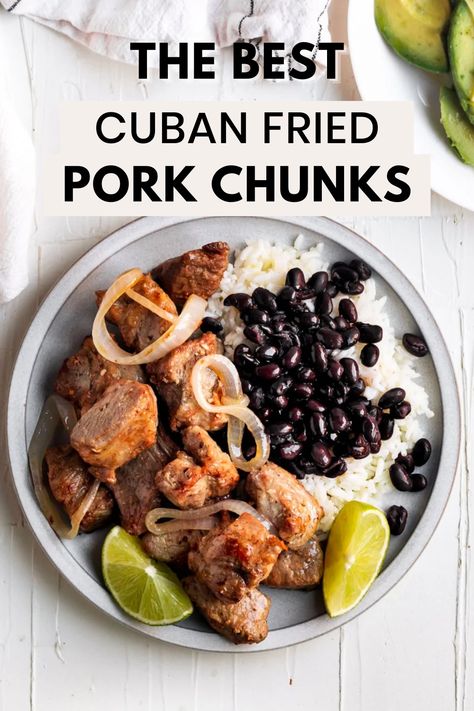 An overhead shot of a plate with Masitas de puerco and white rice and black beans with the words "the best cuban fried pork chunks" in the foreground Pork Chunks Recipes Instant Pot, Pork Shoulder Chunks Recipes, Cuban Pork Recipes, Pork Black Beans And Rice, Sides For Cuban Mojo Pork, Cuban Pork Butts In The Oven, Pork Chunks Recipes Easy, Pork Chunks Recipes, Fried Pork Chunks Puerto Rican