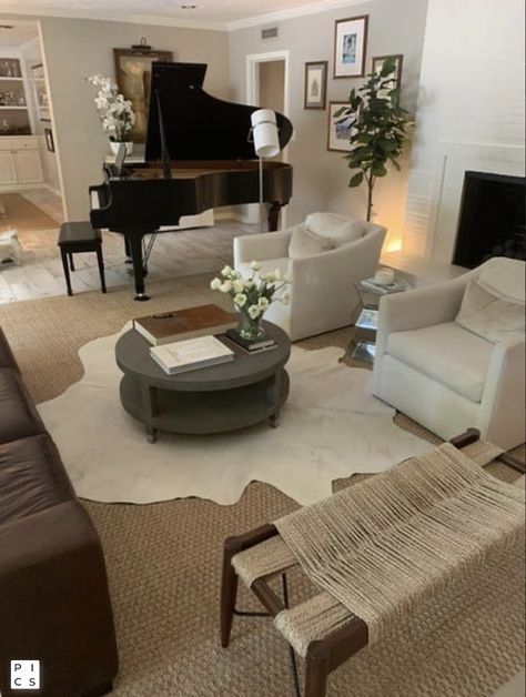 Rug Over Jute Rug, Double Layer Jute Rug, Layering Hide Rugs, Jute Rug Over Carpet Living Room, Jute Rug On Carpet, Cowhide Rug Decor Ideas, Cowhide Rug Aesthetic, Layered Jute Rugs, Rug Stacking Living Rooms