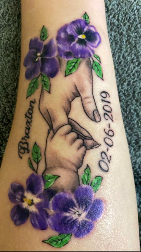 Febuary’s birth flower is violets and birthstone is purple. Absolutley LOVE this tattoo! Birth Flower Tattoos Violet, Rose And Violet Tattoo, Violet Flower With Name Tattoo, Realistic Violet Flower Tattoo, African Violet Tattoo, Mother Son Tattoo, Purple Rose Memorial Tattoo, Rose Tattoo With Name, Name Flower Tattoo