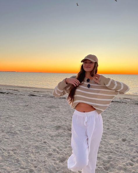 beach outfit, tan striped sweater, white beach pants Cute Beach Outfits Cold Weather, Sunset Outfits Beach Comfy, Beach Outfit Long Sleeve, Comfy Beach Outfit Winter, Winter Outfits For Beach, Chilly Beach Day Outfit Casual, Covered Beach Outfit, 60 Degree Beach Outfit, Fall Beach Date Outfit