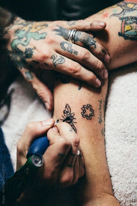 Tattoo Artist Tattooing A Womans Arm" by Stocksy Contributor "Kkgas Getting Tattooed Photography, Get A Tattoo Aesthetic, Doing Tattoo Aesthetic, New Tattoo Aesthetic, Tattoo Shop Pictures, Tattoos Vision Board, Tattoo Artist Working, Tattoo Shop Photoshoot, Tattoo Photography Ideas