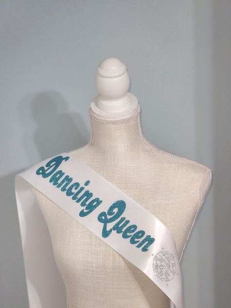 70s Inspired Dancing Queen Last Disco Bachelorette Sash perfect for Bridal Showers and Bachelorettes. Color Pictured: Mint Designed to be worn over the right shoulder and fastened at the left hip All orders include Adult Size: 4 in × 72 in polyester satin sash and safety pin only. Dancing Queen Bday Party, Abba Inspired Party, Mama Mia Homecoming, Mama Mia 16th Birthday Party, Mamma Mia Party Decorations 17, Mama Mia 17th Birthday Party Theme, Mamma Mia Prom Theme, Abba 17th Birthday Party, Mamma Mia Birthday Party Decorations