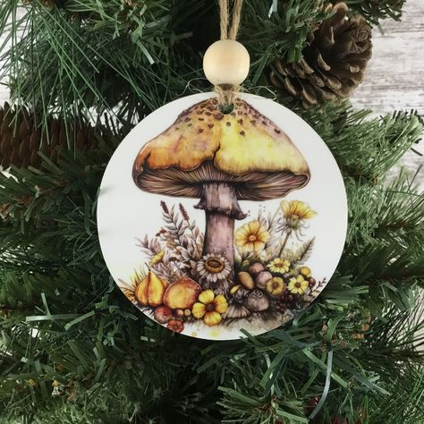 🌿✨ New Woodland Christmas Ornaments Added to the Shop! 🎄🍄 Bring a touch of nature to your holiday decor with our Woodland Mushroom Ornaments! Choose from two beautiful designs: a single mushroom with yellow wildflowers, or a pair of mushrooms surrounded by vibrant orange flowers. Both 3.5" round wooden ornaments are double-sided and come with rustic bead and twine hangers. Perfect for nature lovers or anyone looking to add a cozy woodland vibe to their Christmas tree! 🌼🍂 Shop now and bring... Mushroom And Flowers, Woodland Christmas Ornaments, Orange Wildflowers, Woodland Ornaments, Whimsical Woodland, Yellow Wildflowers, Wood Painting Art, Woodland Christmas, Wooden Christmas Ornaments