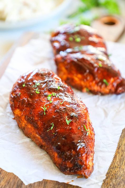 This 30 Minute Baked BBQ Chicken Breast is a summer recipe you can enjoy all year long! The chicken is slathered in a sweet, smoky, savory spice blend, covered in BBQ sauce, then baked until tender and juicy. Serve this Oven-Baked BBQ Chicken with any of your favorite summer side dishes. It's a meal that the whole family will love that takes just 5 minutes to prep. Serve this BBQ Oven Baked Chicken as is or shred it up and use it in another recipe! Oven Baked Bbq Chicken Breast, Baked Bbq Chicken Breast, Bbq Baked Chicken Breast, Baked Bbq Chicken Recipes, Bbq Chicken Breast Recipe, Oven Baked Bbq Chicken, Moist Chicken Breast, Easy Bbq Recipes, Savory Spice