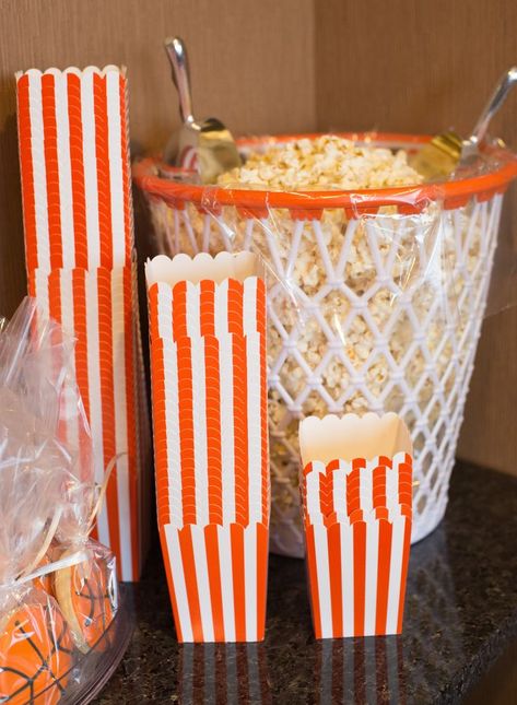 2016 Basketball Party | Create a fun snack bar complete with popcorn. We put ours in a basketball net bin and provided striped popcorn boxes for easy refills! Ideas For Sweet 16, Basketball Themed Birthday Party, Basketball Theme Birthday, Ball Birthday Party, Basketball Baby Shower, Bar Deco, Basketball Theme Party, Sweet 16 Themes, Basketball Birthday Parties