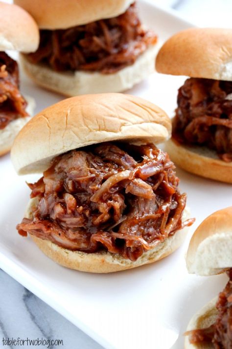 Mini BBQ Pork Sliders {Crockpot} - Table for Two--I used a bottle of Angry Orchard Traditional Dry and Ray's bbq sauce. Very good, very easy! Pork Sliders Crockpot, Bbq Pork Crockpot, Mini Crockpot, Pork Crockpot, Bbq Appetizers, Roast Beef Sandwich, Pulled Pork Sandwiches, Pork Bbq, Pulled Pork Sliders