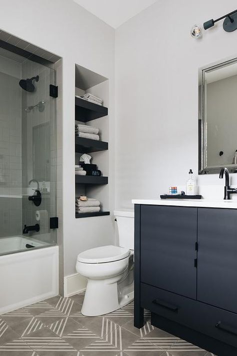 Built-in black nook shelves next to a bathroom shower in a modern bathroom designed with a black washstand fitted with a matte black gooseneck faucet. Built In Bathroom Shelves, Nook Shelves, Laundry Room Flooring, Cottage Room, Pantry Shelving, Black Shelves, Island Countertops, Beautiful Home Designs, Boys Bathroom