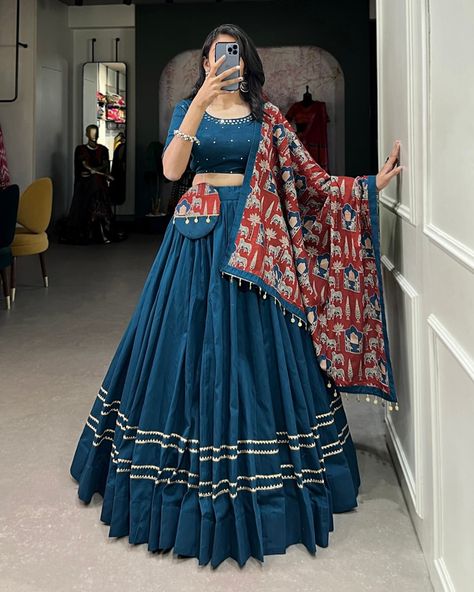 Dance through Navratri nights in this beautifully printed pure cotton lehenga choli. Complete with a matching purse and intricate coin lace detailing, it's perfect for the celebrations! 🥰 *Lehenga (Stitched)* Lehenga Fabric : reyon Cotton Lehenga Work : Plain With Gota Patti Touch Up Lehenga Waist : Support Up To 42 Lehenga Closer : Drawstring With Zip Stitching : Stitched With Canvas Length : 41 Flair : 6 -7 Meter Inner : Micro Cotton *Blouse (Unstitched)* Blouse Fabric : reyon Cotton ... Coin Lace, Cotton Lehenga Choli, Mirror Hand Work, Zip Stitching, Chaniya Choli Designs, Garba Dress, Simple Lehenga, Navratri Dress, Cotton Lehenga