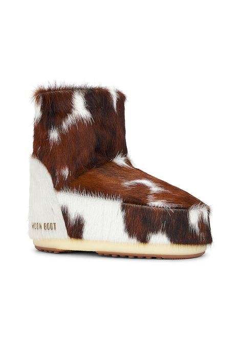 Dyed calf hair upper with rubber sole.  Made in Romania, Fur Origin: Italy.  Pull-on styling.  Moon Boot logo at lateral panels.  .  .  .  Approx 195mm/ 7.5 inch shaft.  .  .  .  .  .  .  .  . Warm Winter Shoes, Moon Boots Fur, Rugged Brown Shearling Boots, Brown Shearling Boots With Rubber Sole, Luxury Brown Shearling Boots, Vintage Fur Boots, Canada Winter, Womens Designer Boots, Accessory Inspo