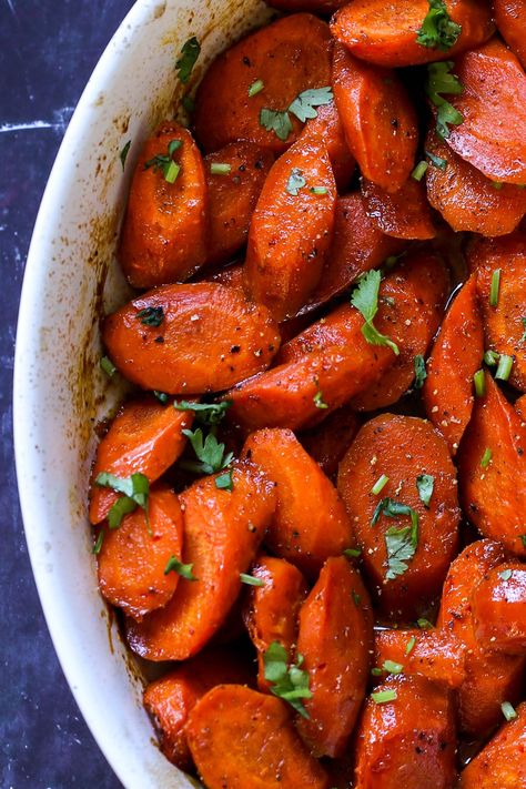 Tender, spiced glazed carrots with a maple glaze and Indian spices is an easy side dish for the holidays or any day! You make the whole dish in one baking pan. Roasted Glazed Carrots, Thanksgiving Spread, Maple Glazed Carrots, Vegan Richa, Vegan Thanksgiving Recipes, Curry Spices, Vegan Sides, Easy Side Dish, Glazed Carrots