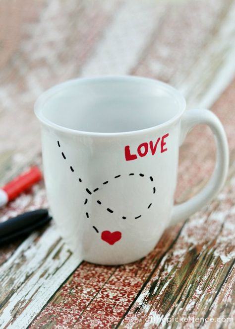 It's so easy during Valentine's Day to get wrapped up in expensive gift giving.  Now don't get me wrong, I love roses and perfume and jewelry as much as the next girl but I also love sweet, simple gifts as well. Like this Love Mug that you can easily make yourself! All you need is an inexpensive mug, paint pens and an oven! [Click Here To Continue Reading...]   If you are reading this post from your email,  we want to let you know that our posts will no contain the option to re... Diy Valentines Gifts For Him, Diy Valentine Gifts For Boyfriend, Diy Valentines Day Gifts For Him, Diy Keramik, Saint Valentin Diy, Valentines Bricolage, Sharpie Crafts, Sharpie Mug