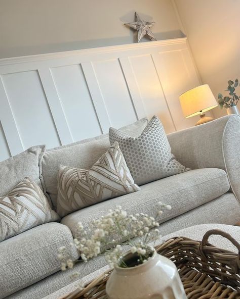 Panelling White Wall, Living Room Feature Wall Panelling, Ideas For Bare Wall In Living Room, Living Room Panelling With Shelf, Modern Living Room Panelling Ideas, High Panelling Living Room, Paneling Behind Sofa, Neutral Living Room Panelling, Beige Panelling Living Room