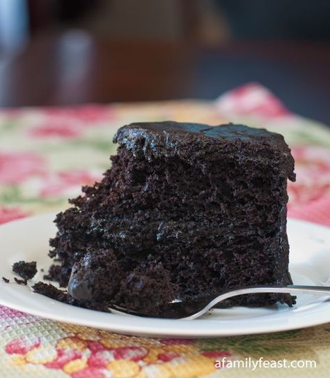 Nanny's Black Midnight Cake - This recipe is an updated version of a cake that my husband's mother used to bake for many years. It's a super moist and delicious chocolate cake with a sweet, dark chocolate frosting. Perfection! Midnight Cake, Tasty Chocolate Cake, Gateaux Cake, Family Feast, A Piece Of Cake, Pudding Cake, Hot Fudge, Piece Of Cake, How Sweet Eats