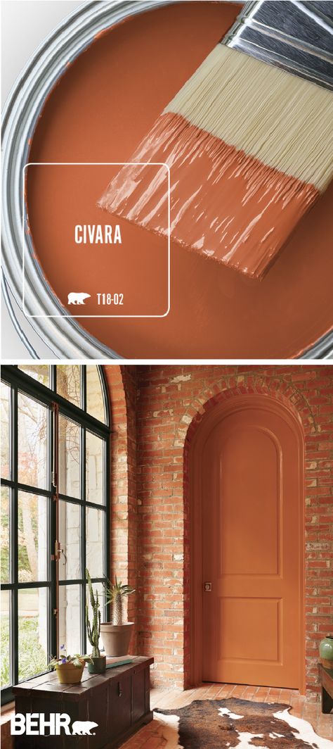 Snuggle up to the warm and cozy style of Civara by BEHR® Paint. This bright red-orange color comes together with exposed brick walls, plenty of natural light, dark wood furniture, and a cowhide rug to create this open and welcoming space. How will you use this colorful paint shade in your home? Click below for more inspiration. Behr Paint Colors, Dark Wood Furniture, Behr Paint, Orange Paint, Exposed Brick Walls, Paint Can, Colour Inspiration, Trendy Bedroom, Exterior Paint Colors