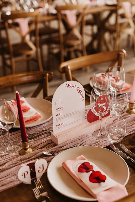 Pink and red wedding theme with heart shaped sunglasses favours with arched wedding menu Heart Theme Wedding, Red And Pink Wedding Table Decor, Pink And Red Themed Wedding, Pink And Red Table Decor, Valentines Wedding Decor, Retro Wedding Arch, Red And Ivory Wedding Theme, Wedding Red And Pink, Pink And Red Tablescape