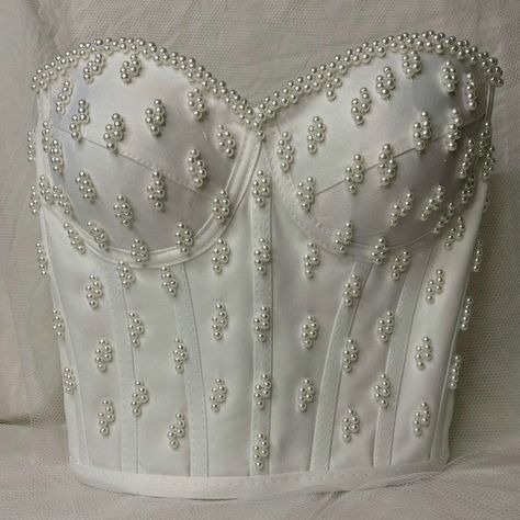 Featuring intricate rhinestones and beadwork, this stunning corset top is perfect for any special occasion. The back is designed with adjustable lace-up ties, ensuring a perfect fit every time. Each piece is custom-made with love and crafted to perfection. Order yours today and shine bright! Molde, Wedding Corset Top, Madam Pompadour, Bridal Corset Top, Bjd Outfits, Bridal Crop Top, White Corset Dress, Wedding Corset, White Corset Top