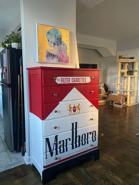 A dresser painted to look like a pack of Marlboro Red Cigarettes Aesthetic Shoe Storage Ideas, Cool Room Wallpaper, Spicy Room Decor, Weird Aesthetic Room, Unique Home Furniture, Graffiti Furniture Ideas, Bar Themed Room, Weird House Decor Diy, Fun Storage Ideas