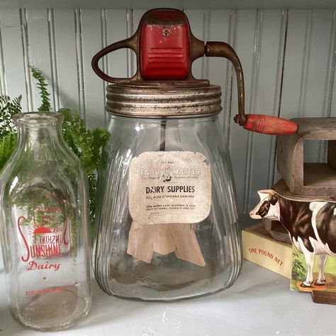 "The original Sears & Roebuck \"Farm Master\" label is still attached to this mechanical butter churn. Aesthetically it is great shape.  The glass is clear and free of cracks.  The red painted metal housing and handle are attractive.  The handle and gears function properly to turn the wooden paddles. The churn is 13\" tall. This listing is for the butter churn only.  Props sold separately." Butter Churner, Farm Kitchen Decor, Folgers Coffee, Butter Churn, Wooden Paddle, Butter Molds, Vintage Kitchen Utensils, Churning Butter, American Farmhouse