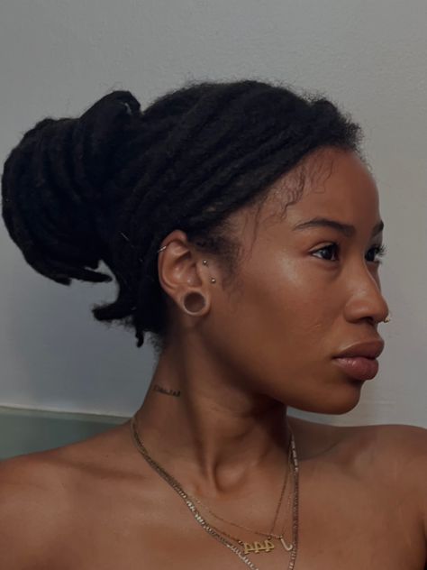 Black woman with locs Gauge Ears Black Women, Gauged Ears Black Women, Ear Gauges Aesthetic Black Women, Gauge Ears Women, Gauged Ears Women Aesthetic, Gauges On Black Women, Thick Short Locs Styles, Locs Tattoo Ink Black Women, Ear Gauges Black Women