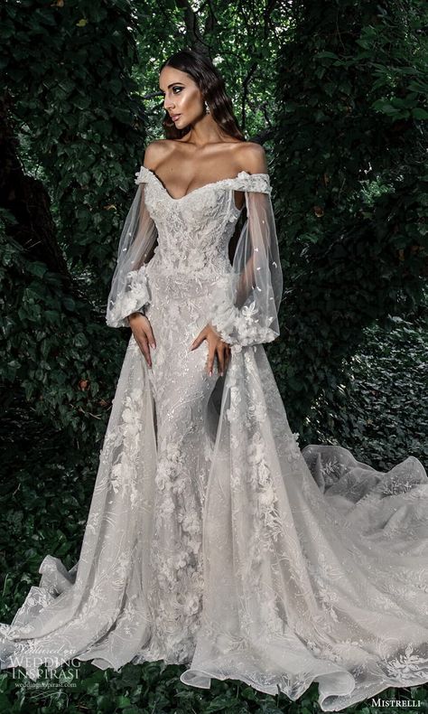 mistrelli 2022 misteriosa bridal sheer bishop sleeve off shoulder v neckline fully embellished lace fit flare mermaid wedding dress a line overskirt chapel train (4) mv -- Mistrelli 2022 Couture Wedding Dresses | Wedding Inspirasi #wedding #weddings #bridal #weddingdress #weddingdresses #bride #fashion #collection:Misteriosa #label:Mistrelli #week:352021 #year:2022 ~ Embellished Mermaid Wedding Dress, Mermaid Lace Off The Shoulder Wedding Dress, Long Sleeve Mermaid Wedding Dress With Overskirt, Black Dress Wedding Dress, Wedding Dresses Dramatic Sleeves, Lace Mermaid Wedding Dress With Overskirt, Bishop Sleeve Mermaid Wedding Dress, Mermaid Train Wedding Dress, Elegant Dresses Wedding Dress