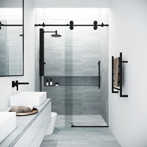 The VIGO Elan adjustable frameless shower door is everything you want and need to complete your bathroom remodel. The sliding door has a fixed glass panel, made from 3/8" ANSI Z97.1 and 16 CFR 1201-certified clear tempered glass to resist dangerous breakage, shards, and streaks. Incredibly sturdy and stable, the door has top rail support that ensures wall anchoring and reinforces wall stability. Its rails are stainless steel tubes, built to withstand more than the required weight. In addition Black Shower Doors, Frameless Sliding Shower Doors, Modern Bathroom Remodel, Frameless Shower Door, Tub Doors, Geek Decor, Frameless Shower Doors, Bathroom Remodel Shower, Sliding Shower Door