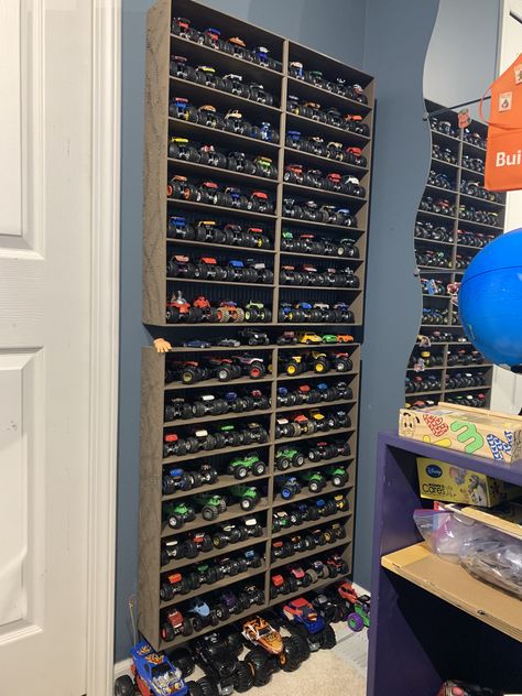 Toy Storage For Large Trucks, Monster Jam Playroom, Monster Jam Toy Storage, Monster Truck Garage Diy, Monster Jam Storage Ideas, Monster Truck Toy Storage Ideas, Diy Monster Truck Storage, How To Store Monster Trucks, Monster Truck Wall Storage