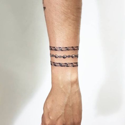 Chain Tattoos on Arm. Universal Tattoo, Chain Tattoos, Arm Cuff Tattoo, Bracelet Tattoo For Man, Name Tattoos On Arm, Tattoos On Arm, Wrap Around Wrist Tattoos, Wrist Band Tattoo, Blonde Tattoo