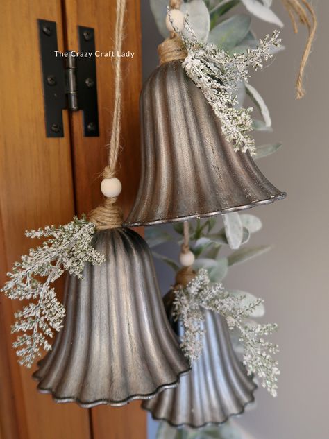 Make this DIY silver bell trio and transform plastic bells from the dollar store into high-end holiday decor Diy Jingle Bell Garland, Bundt Pan Christmas Crafts, Rustic Christmas Bells Diy, Silver Bells Christmas Party Theme, Large Bells Christmas Decor, Diy Bejeweled Christmas Ornaments, Vintage Christmas Store Displays, Diy Large Bells, Dollar Store Winter Decor