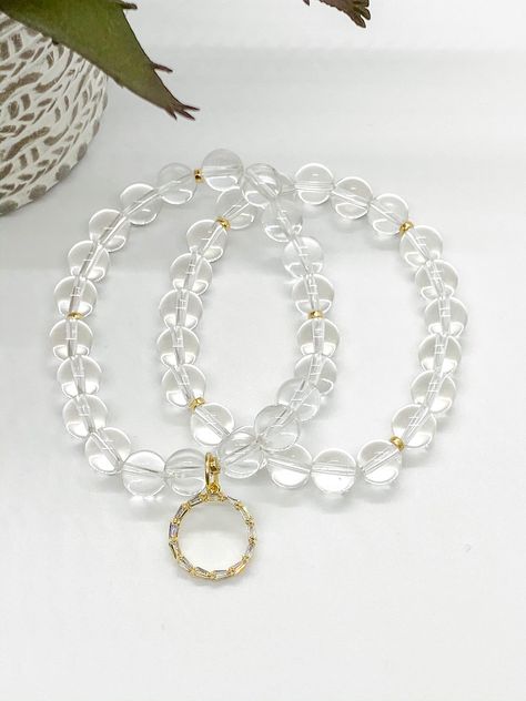 Clear Quartz Crystal (8mm) with GF beaded accents -stretchable 6.5-8 in. with beautiful GF Crystal Charm layered w/clear quartz bracelet  Quartz= (Master Healer) All handmade with LOVE! Clear Beaded Crystal Bracelet Gift, Elegant Clear Beaded Crystal Bracelet, Clear Crystal Bracelet With 8mm Beads, Clear Quartz Bracelet, Spiritual Clear Quartz Jewelry, Bracelets Design, Crystal Charm, Quartz Bracelet, Clear Quartz Crystal