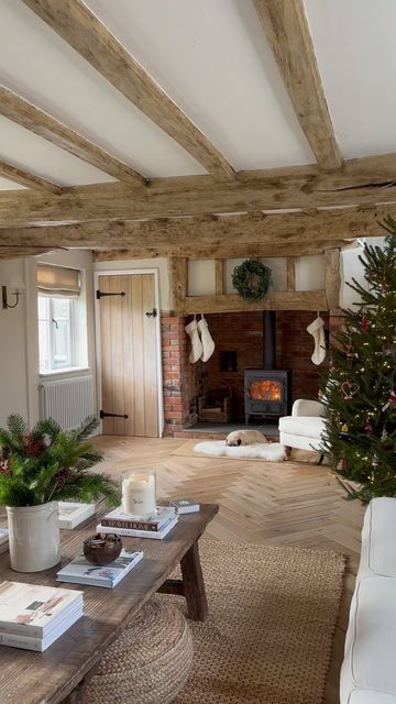 Victoria Lusty on Instagram: "Happy Festive Friday All 🎄 Hope you all have a great weekend. Frank will undoubtedly be occupying this spot, most of the weekend. #cottagechristmas #christmastree #christmasdecor #cottageinteriors #cottagestyle #mycosycottage #englishcottagestyle #englishcountryhomes #oldhouselove #periodhome #neutralhome #neutralhomedecor #cotswolds #cotswoldcottage #farmhousestyle #oldfarmhouse #rusticdecor #beams #periodlivingxmas #inglenook #logburner #pugstagram" Stone Cottages Interior, Salons Cottage, Cottage Lounge, Cottage House Interior, Cotswold House, English Cottage Interiors, Cotswold Cottage, Cotswolds Cottage, Inglenook Fireplace