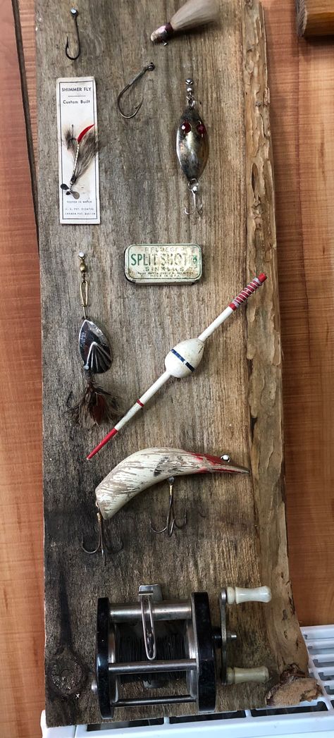 Vintage fishing lure display Vintage Fishing Lures Display, Lure Display Ideas, Old Fishing Lures Crafts, Fishing Lure Display Ideas, Fishing Lure Display, Fishing Reel Display, Fishing Cabin Decorating Ideas, Old Fishing Lures Display Ideas, Fishing Lure Decor