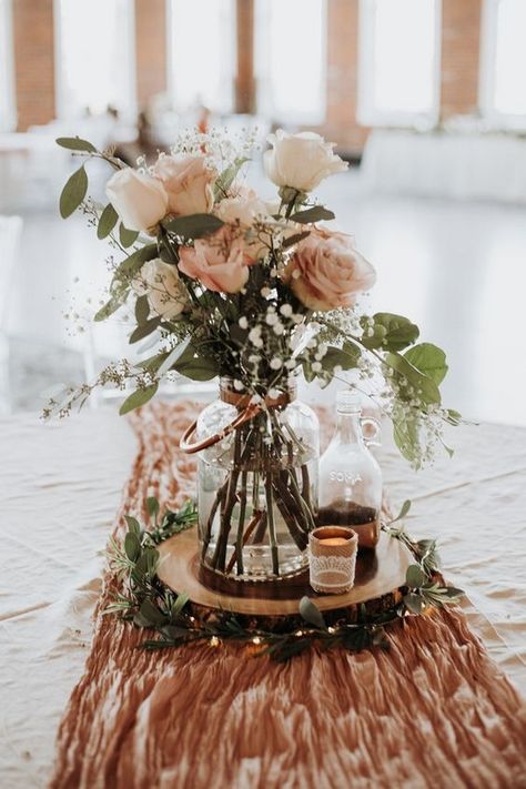 dusty rose wedding centerpiece ideas #wedding #weddings #weddingcolors #weddingideas #pinkweddings #greenweddings #hmp Dusty Rose Table Runner Wedding, Rustic Vintage Party Decor, Wedding Table Centerpieces With Wood Rounds, Rustic Mauve Wedding Decor, Table Runners For Round Tables Wedding, Sage Table Runner Round Table, 2023 Wedding Ideas Decor, Wood Flower Wedding Decor, Table Runner Circle Table Wedding