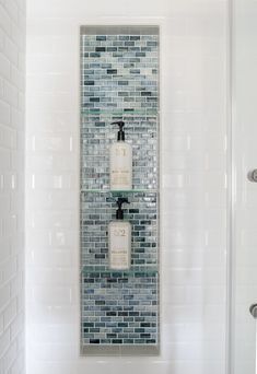 Shower Niche With Glass Shelf, Blue Glass Bathroom Tile, Vertical Shower Niche With Shelves, White Shower With Niche, White And Blue Shower Tile Ideas, Blue Bathroom Shower Tile, Blue Accent Tile Shower Wall, Verticle Tile Bathroom, Blue Tiled Shower Ideas