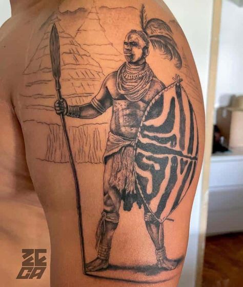 Shaka Zulu Emblem Tattoo African Leg Tattoo, Zulu Tattoo Ideas, African Related Tattoos, African Theme Tattoo, Mansa Musa Tattoo, Zulu Shield Tattoo, African Gods Tattoo, African Art Tattoo Ideas, Zulu Tattoo