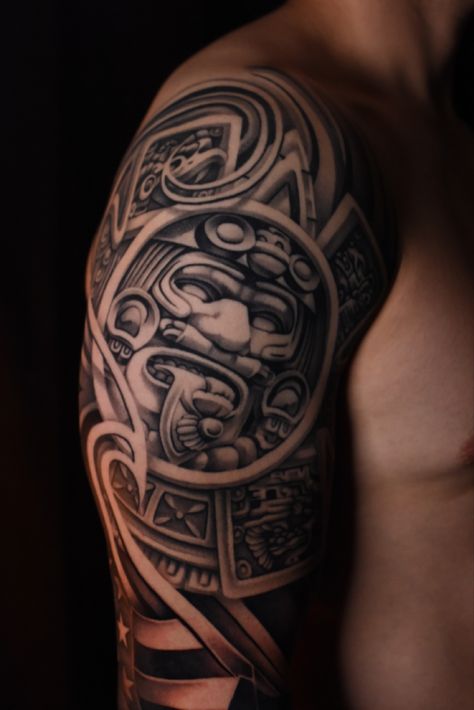 Aztec style tattoo, large scale on right shoulder black and grey Aztec Man Tattoo, Aztec Realism Tattoo, Aztec Tattoo Mexican Forearm, Ollin Aztec Tattoo, Aztec Gods Tattoo, Aztec Calendar Chest Tattoo, Aztec Calendar Tattoo Design, Aztec Calendar Tattoo, Mexican Aztec Warrior Tattoo