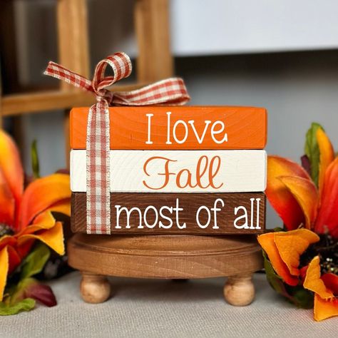 NEW BOOK STACK SIZE AVAILABLE!  This cute fall wooden book stack bundle is the perfect addition to your fall tiered tray decorations. It will bring the cozy fall feel to your home and look perfect wherever you decide to put it. Whether it be on a tiered tray, fall farmhouse mantle, bookshelf or as part of an autumn decorative centerpiece. All of our mini book stacks and larger size bookstacks are handmade & hand painted. ❤PLEASE READ DESCRIPTION, PROCESSING TIMES & ESTIMATED SHIPPING DATES IN IT Fall Serving Tray, Mantle Bookshelf, Farmhouse Mantle, Fall Wood Crafts, Fall Tiered Tray Decor, Fall Farmhouse, Fallen Book, Wood Book, Wooden Books