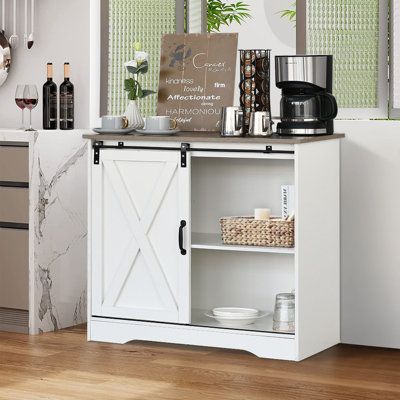 Features:This white coffee bar cabinet combines a perfectly modern style with a farmhouse design. This buffet storage cabinet is featuring a sliding barn door and rustic wood vintage color. If you want to add more farmhouse flavor to your home, this farmhouse barn door buffet coffee bar cabinet will be a great choice. This farmhouse coffee bar cabinet can blend easily all kinds of decor rooms. If you are a coffee-obsessed and cup-collecting lover, this farmhouse sliding barn door coffee bar cabi Dining Room Buffet Cabinet, Farmhouse Buffet Cabinet, Bar Cabinet Design, Grey Farmhouse, Living Room Storage Cabinet, Coffee Bar Cabinet, Farmhouse Buffet, Cabinet With Storage, Farmhouse Coffee Bar