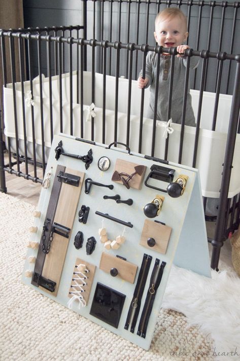 Keep your little one occupied while keeping your style too, check out this stylish rustic baby busy board from www.tableandhearth.com! Baby Activity Board, Diy Busy Board, Diy Sensory Board, Toddler Activity Board, Busy Board Baby, Baby Table, Baby Sensory Play, Baby Play Activities, Busy Boards For Toddlers