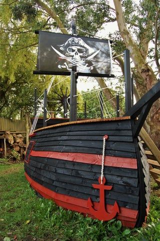 Pallet Pirate Ship, Build A Pirate Ship, Pirate Ships Diy, Sunken Pirate Ship, Build A Pirate, Ship Playhouse, Kids Pirate Ship, Pirate Ship Playhouse, Pirate Halloween Decorations