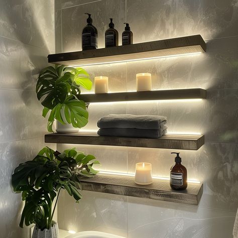 Three_backlit_floating_shelves_in_a_bathroom._The_to 4 Floating Shelf Ideas, Wall Shelves Living Room, Organizing Essentials, Long Floating Shelves, Bathroom Shelves Over Toilet, Floating Shelves Bedroom, Bathroom Tips, Black Floating Shelves, Spa Interior Design