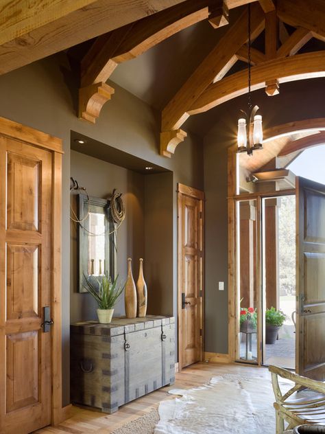 Entry foyer peaked ceiling wall color dark paint earthy tones color might make room look small...but i like it Rustic Lodge Paint Colors, Knotty Pine Paneling, Pine Trim, Fireplace Room, Entry Design, Revere Pewter, Log Cabin Decor, Timber Frame Homes, Mountain Lodge