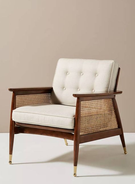 Walnut finish 'Nadia' caned armchair, £698 at Anthropologie. A very elegant chair by Anthropologie with its rich walnut veneer and brass accents, and those caned arms will never go out of style. [button url="https://www.anthropologie.com/en-gb/shop/nadia-caned-accent-chair?color=012&type=REGULAR&size=One%20Size&quantity=1"]Shop now[/button] Home Interiors, Room Decorations, Cane Webbing Chair, Designer Accent Chairs, Hanging Furniture, Cane Furniture, Anthropologie Uk, Cane Chair, Furniture Hacks