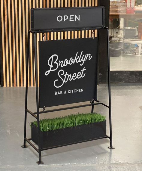 Metal A frame sign with planter A Frame Sign Ideas, A Frame Signage, A Frame Sign Design, Business Banner Ideas, Standing Signage, Coffee Signage, A Frame Sign, London Sign, Sidewalk Signs