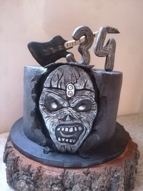 Black birthday cake for 34 yo Iron Maiden fan, with Eddie face figurę and Jackson bass guitar Iron Maiden Birthday, Iron Maiden Cake, Black Birthday Cake, Iron Maiden Eddie, Black Birthday, Iron Maiden, Bass Guitar, Fun Desserts, Amazing Cakes