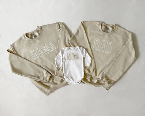 "Each piece is sold separately. These unique embroidered beige and white mama, dad and mini sets for moms and babies and toddlers make for the cutest photos and memories! Each trendy sweatshirt (or bodysuit) is made to order and is perfect for everyday fun as well as baby shower gifting. We also offer custom orders, so feel free to shoot us a message! Our \"mama\" and \"dad\" embroidered sweatshirts come in beige with white lettering and our baby bodysuits and toddler sweatshirts come in white w Family Matching White Sweatshirt With Letter Embroidery, White Family Matching Sweatshirt With Letter Embroidery, Mommy And Me Sweatshirt, Cream Cotton Top With Letter Embroidery, Cream Cotton Tops With Letter Embroidery, Mom And Dad Sweatshirts, Beige Mom, Cute Pregnancy Pictures, Mom Things