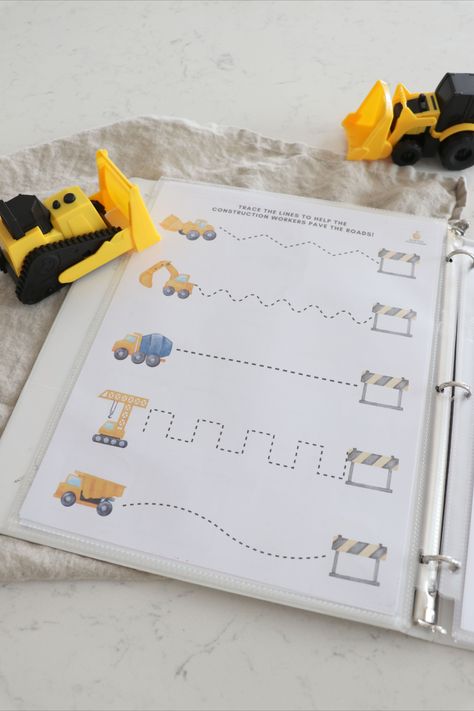 Construction site busy book in binder on white counter with small construction site toys around Morning Binder Kindergarten, Mom Checklist, Preschool Construction, Sheet Protector, Sheet Protectors, Preschool Units, Dot Markers, Homeschool Activities, Construction Site