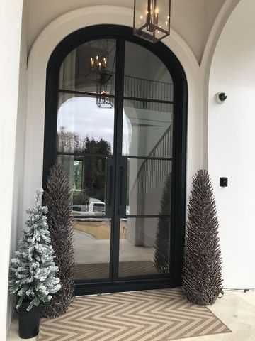 Big Front Doors Black, Big Modern Front Door, Double Front Entry Doors Modern Wrought Iron, Glass Door Design Entrance Front Entry, Glass Double Doors Front Entry, Big Front Doors Modern, Large Double Front Doors, Arched Glass Front Door, Double Entry Doors Modern